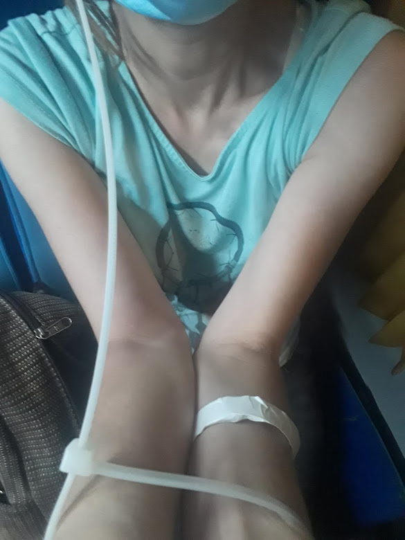 handcuffed hands  with zip ties 